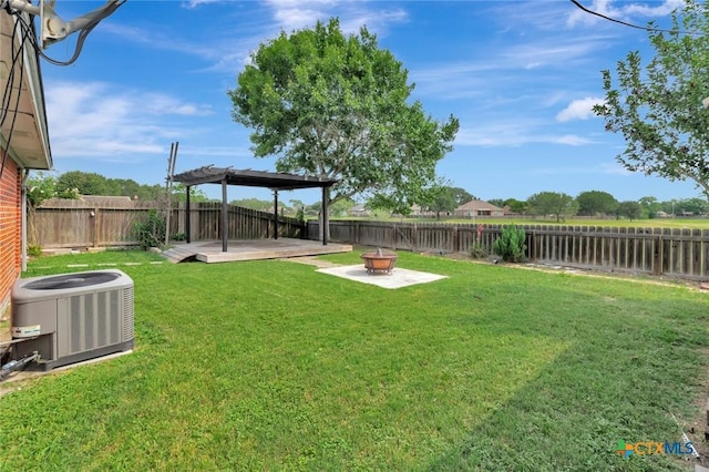 108 Bridle Ln, Victoria, TX 77904 - view of yard with central air condition unit and an outdoor fire pit