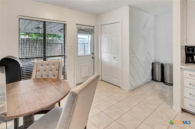 108 Bridle Ln, Victoria, TX 77904 - dining area featuring light tile patterned flooring and a textured ceiling