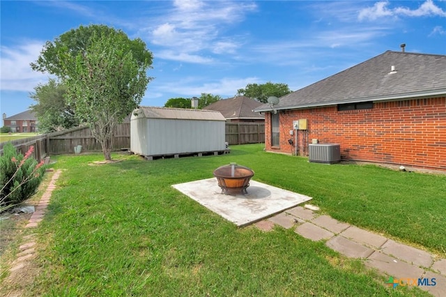 108 Bridle Ln, Victoria, TX 77904 - view of yard with an outdoor fire pit, central air condition unit, and a patio area