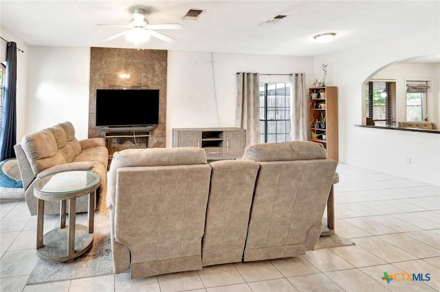 108 Bridle Ln, Victoria, TX 77904 - living room with a ceiling fan, arched walkways, and light tile patterned floors