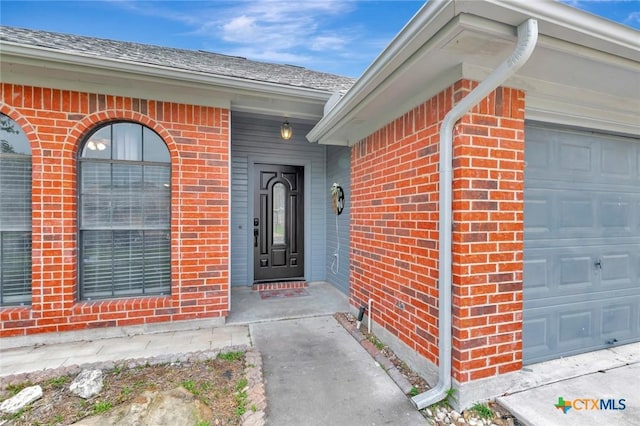 108 Bridle Ln, Victoria, TX 77904 - property entrance featuring brick siding and an attached garage