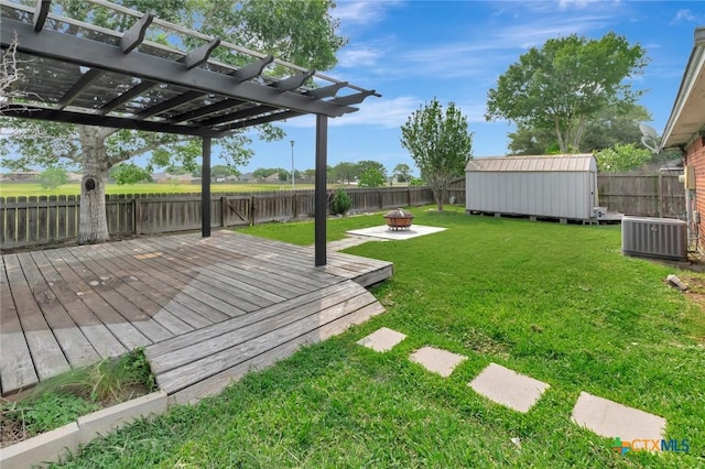 108 Bridle Ln, Victoria, TX 77904 - view of yard with cooling unit, a deck, a fire pit, and a pergola