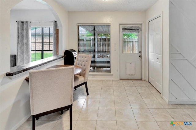 108 Bridle Ln, Victoria, TX 77904 - office with healthy amount of natural light, light tile patterned flooring, and arched walkways