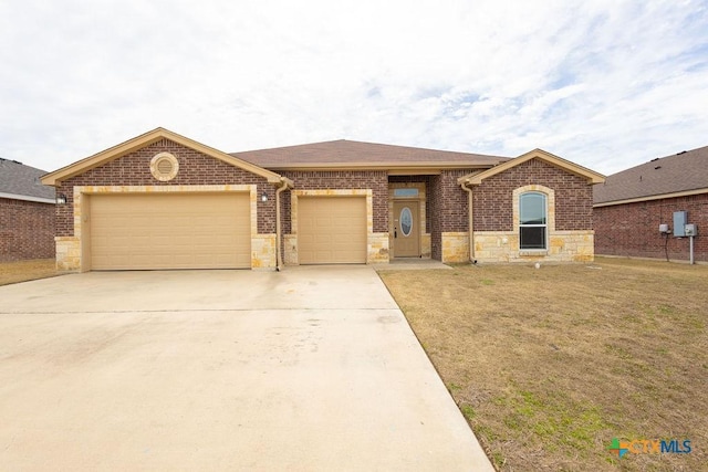 single story home with an attached garage, a front lawn, concrete driveway, and brick siding