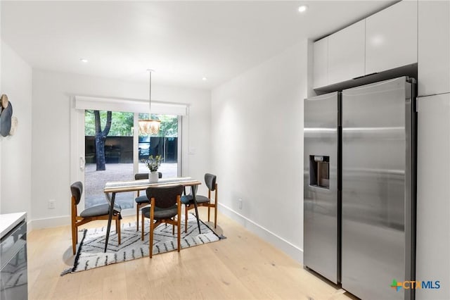 dining area featuring baseboards, a chandelier, light wood-type flooring, and recessed lighting