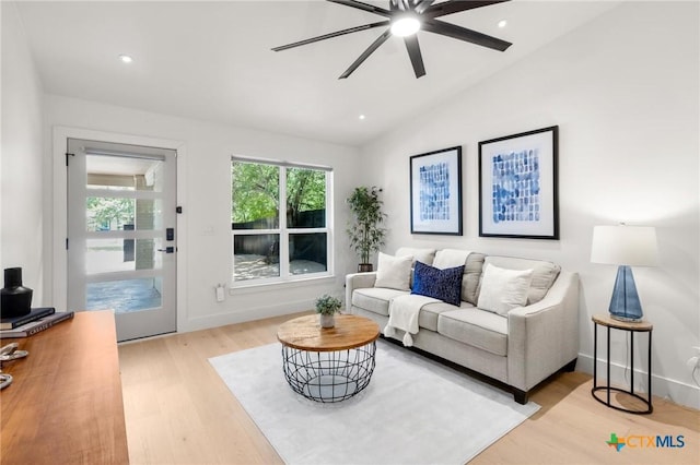living area featuring light wood-style flooring, ceiling fan, lofted ceiling, and recessed lighting