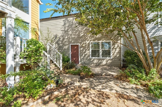 property entrance with a patio