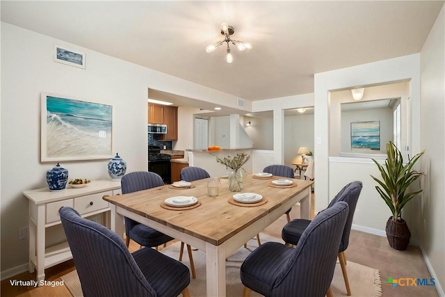 dining space featuring baseboards