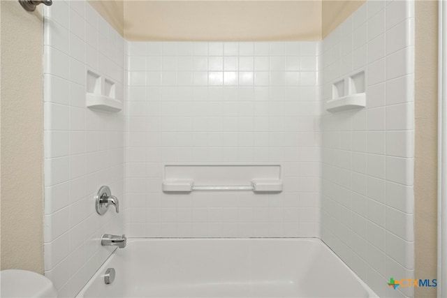 full bath featuring shower / tub combination and toilet