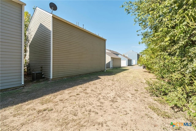 view of property exterior with central AC