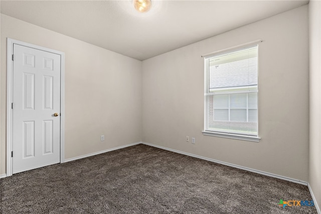 2810 Scottsdale Dr, Killeen, TX 76543 - spare room with dark colored carpet and baseboards