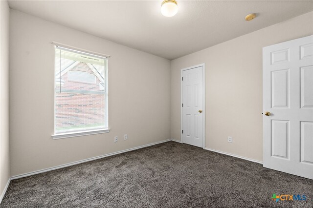 2810 Scottsdale Dr, Killeen, TX 76543 - unfurnished bedroom with carpet flooring and baseboards