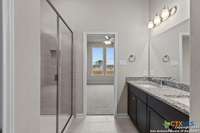 bathroom featuring vanity, tile patterned flooring, ceiling fan, and walk in shower