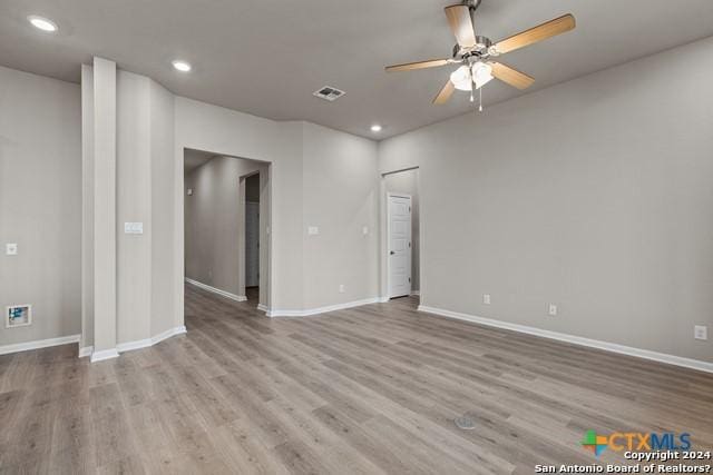 spare room featuring ceiling fan and light wood-type flooring