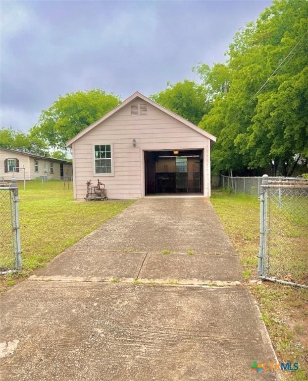 garage with a lawn