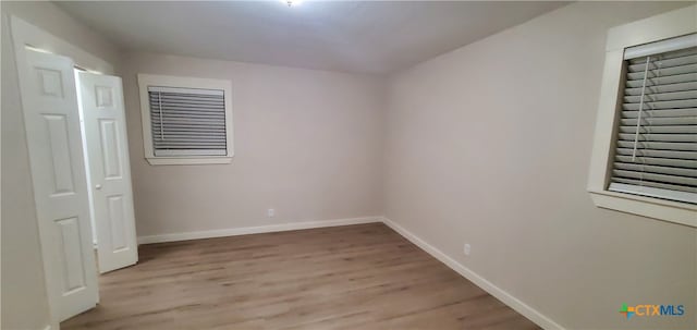 unfurnished room with light hardwood / wood-style flooring