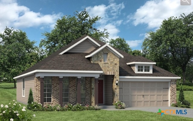 view of front of property with a garage and a front yard