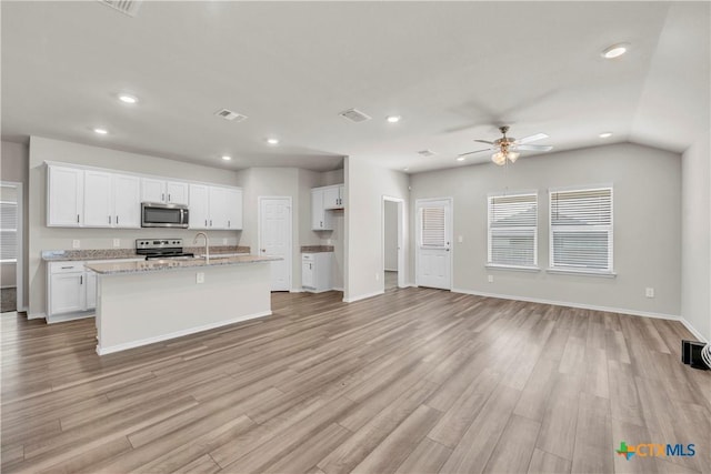2358 Aylesbury Dr, Copperas Cove, TX 76522 - kitchen featuring stainless steel appliances, recessed lighting, ceiling fan, open floor plan, and white cabinets