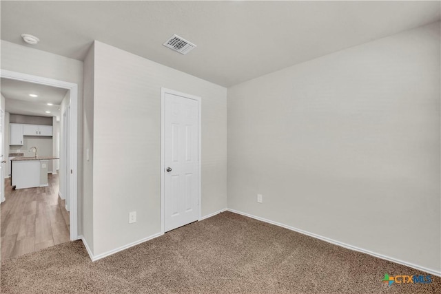 2358 Aylesbury Dr, Copperas Cove, TX 76522 - unfurnished bedroom with light colored carpet and recessed lighting