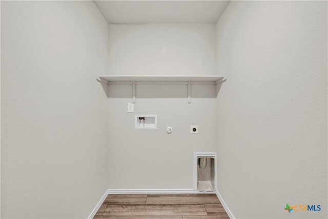 2358 Aylesbury Dr, Copperas Cove, TX 76522 - laundry area with hookup for a gas dryer, wood finished floors, washer hookup, and electric dryer hookup