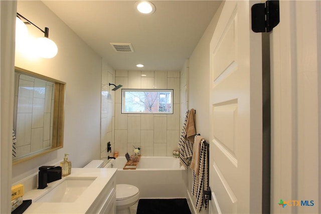 full bath with visible vents, shower / bathing tub combination, toilet, vanity, and recessed lighting