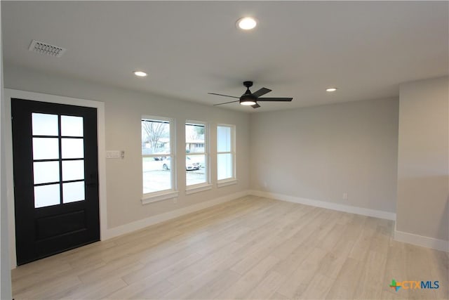 entrance foyer with light wood-style flooring, visible vents, baseboards, and recessed lighting