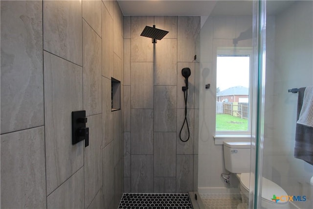 full bath with a shower stall and toilet