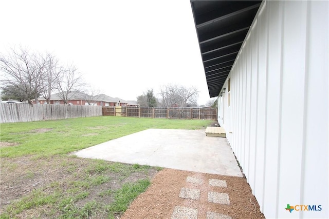 view of yard featuring a patio area and a fenced backyard