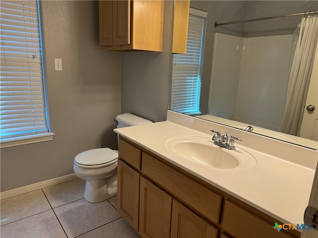 bathroom featuring tile patterned floors, vanity, a shower with shower curtain, and toilet