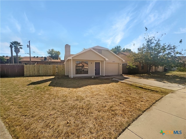 view of front facade with a front lawn and a garage