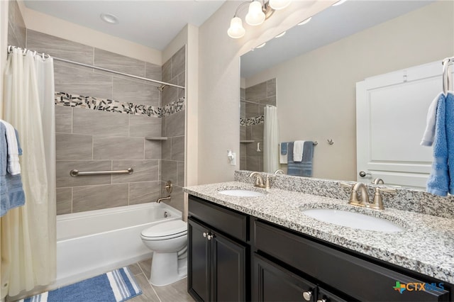 full bath with shower / tub combo, toilet, a sink, and double vanity