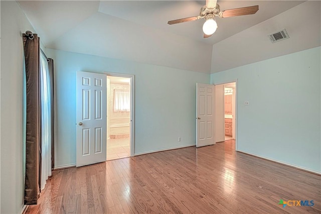 unfurnished bedroom with ceiling fan, light hardwood / wood-style floors, and vaulted ceiling