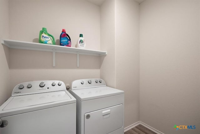 212 Gunther Way, Taylor, TX 76574 - washroom with washing machine and dryer, wood finished floors, and baseboards