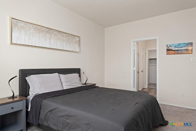212 Gunther Way, Taylor, TX 76574 - bedroom with baseboards and carpet