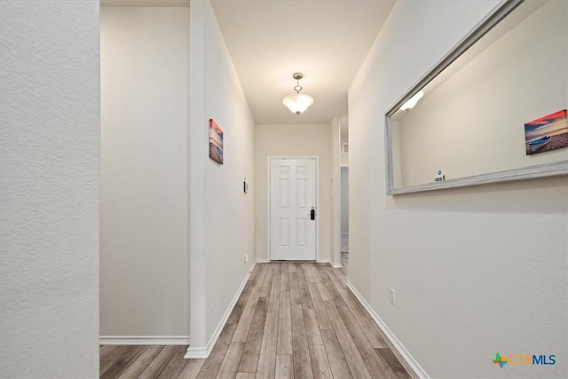 212 Gunther Way, Taylor, TX 76574 - hallway with wood finished floors and baseboards