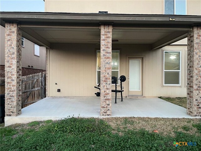 view of patio featuring ceiling fan