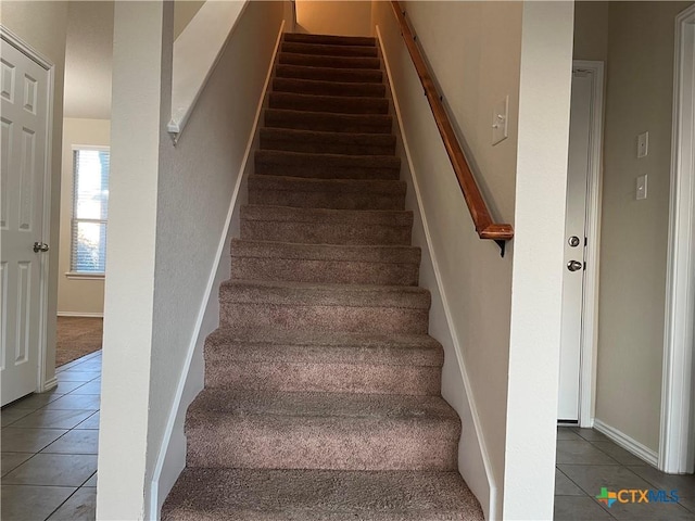 staircase with tile patterned flooring