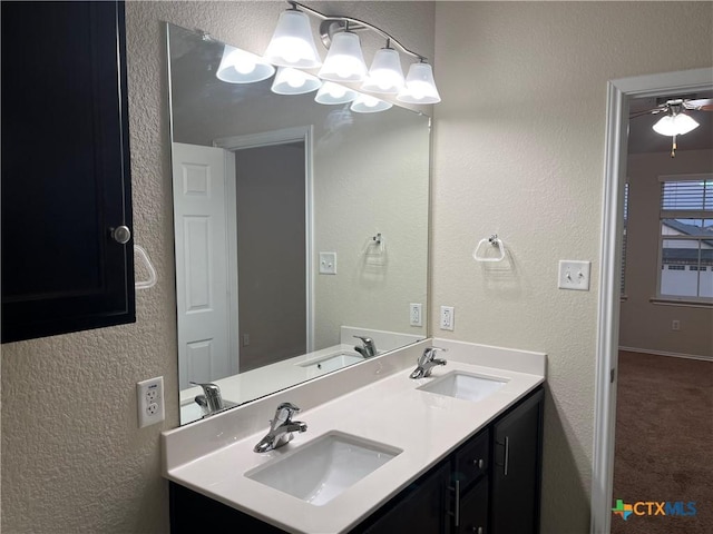 bathroom featuring vanity and a chandelier