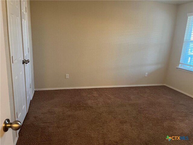 empty room featuring carpet flooring