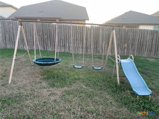 view of playground featuring a lawn