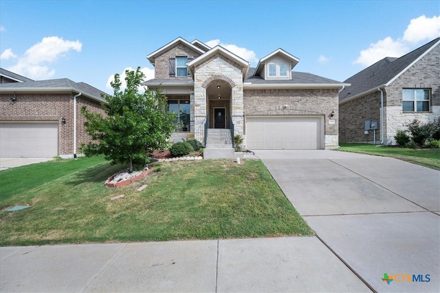 view of front of house featuring a garage and a front lawn