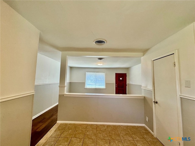 hallway featuring tile patterned floors