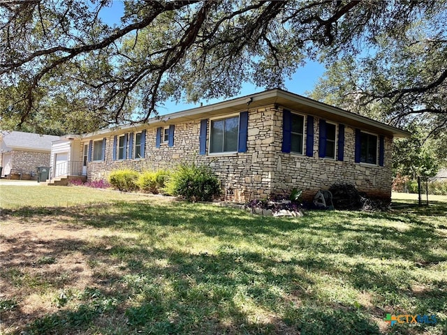 ranch-style house with a front lawn