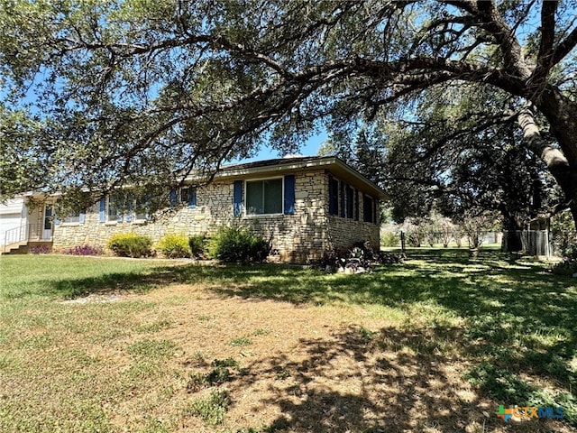 view of property exterior featuring a yard