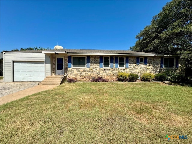 ranch-style home featuring a garage and a front lawn