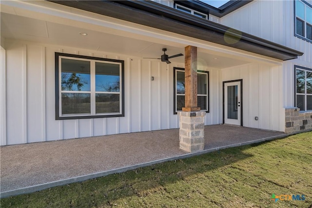 doorway to property with a yard, ceiling fan, and a patio area