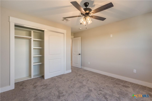 unfurnished bedroom with a closet, ceiling fan, and carpet