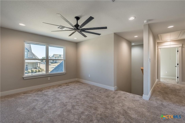 empty room with light carpet and ceiling fan