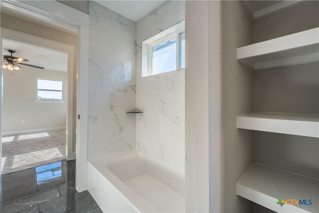 bathroom featuring a healthy amount of sunlight and ceiling fan