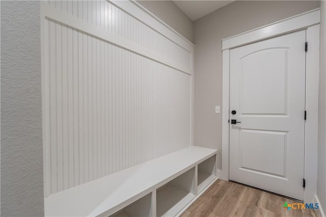 mudroom with light hardwood / wood-style flooring